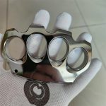 Polished Titanium Knuckle Duster with Sleek Reflective Surface
